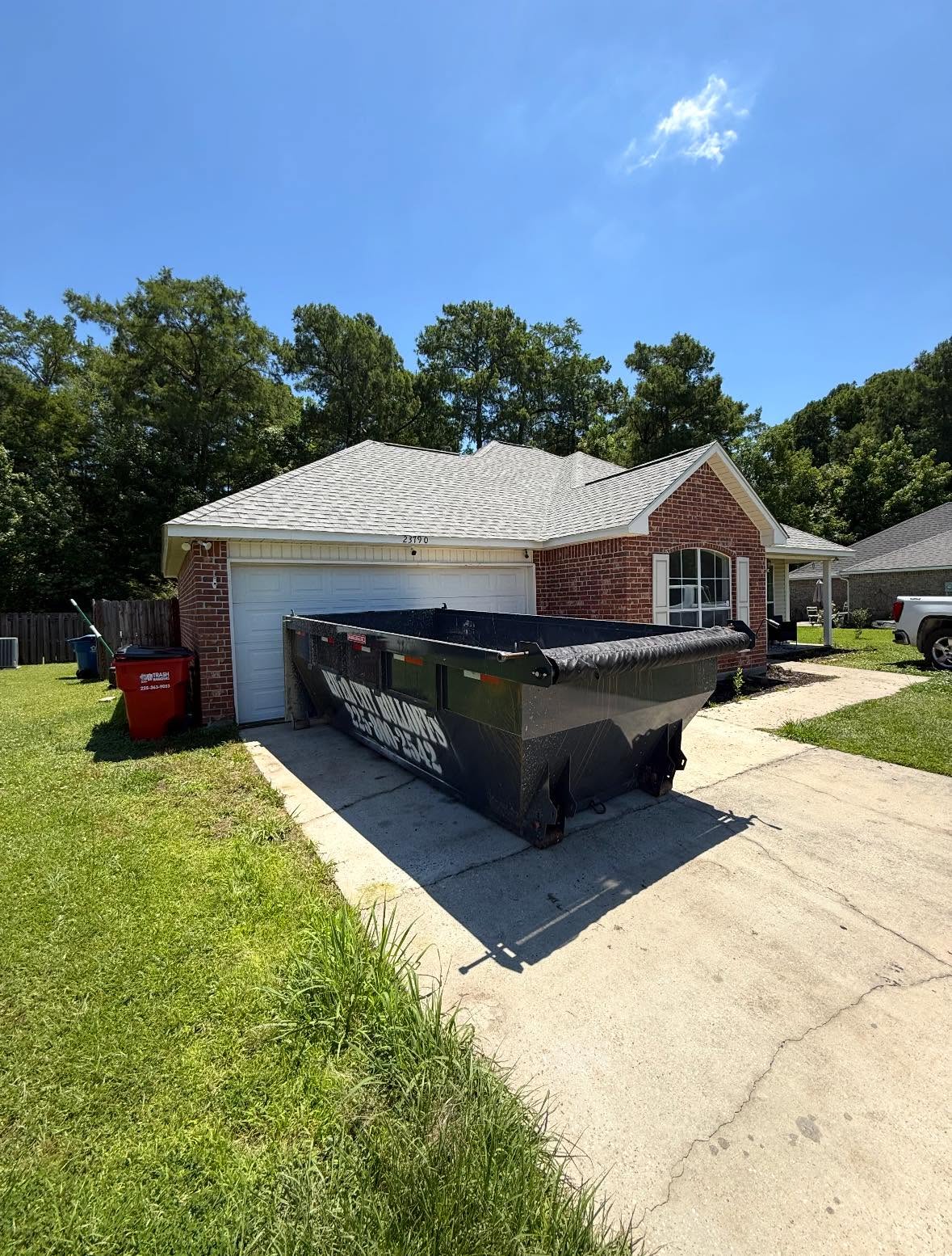 River City rolloff dumpster at a residential property